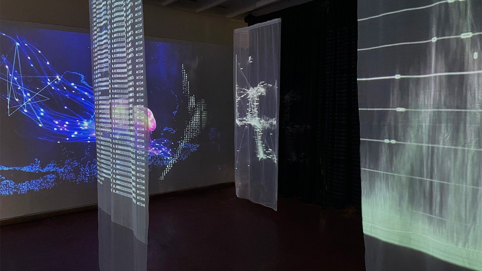 A room of digital projections. banner image