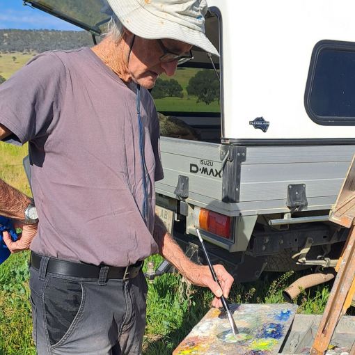 Artist John Sharman painting en plein air.