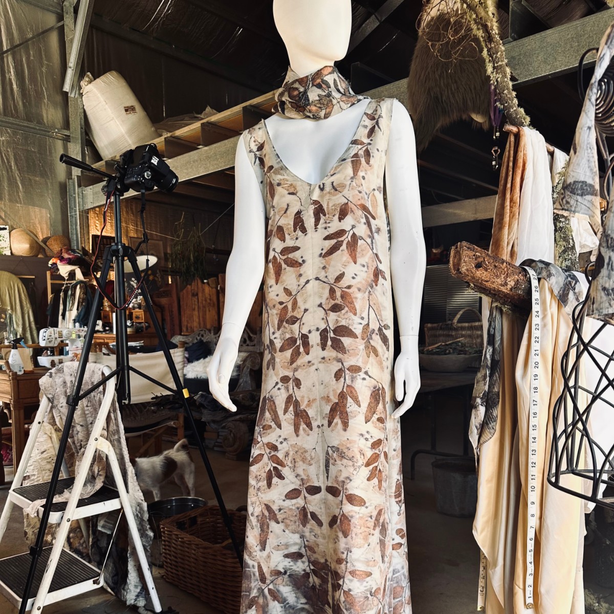 Image Mannequin dressed in botanical print dress with matching scarf.
