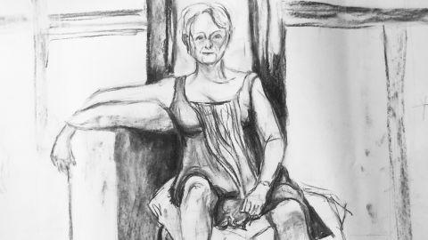 Charcoal sketch of a woman lounging on a chair.